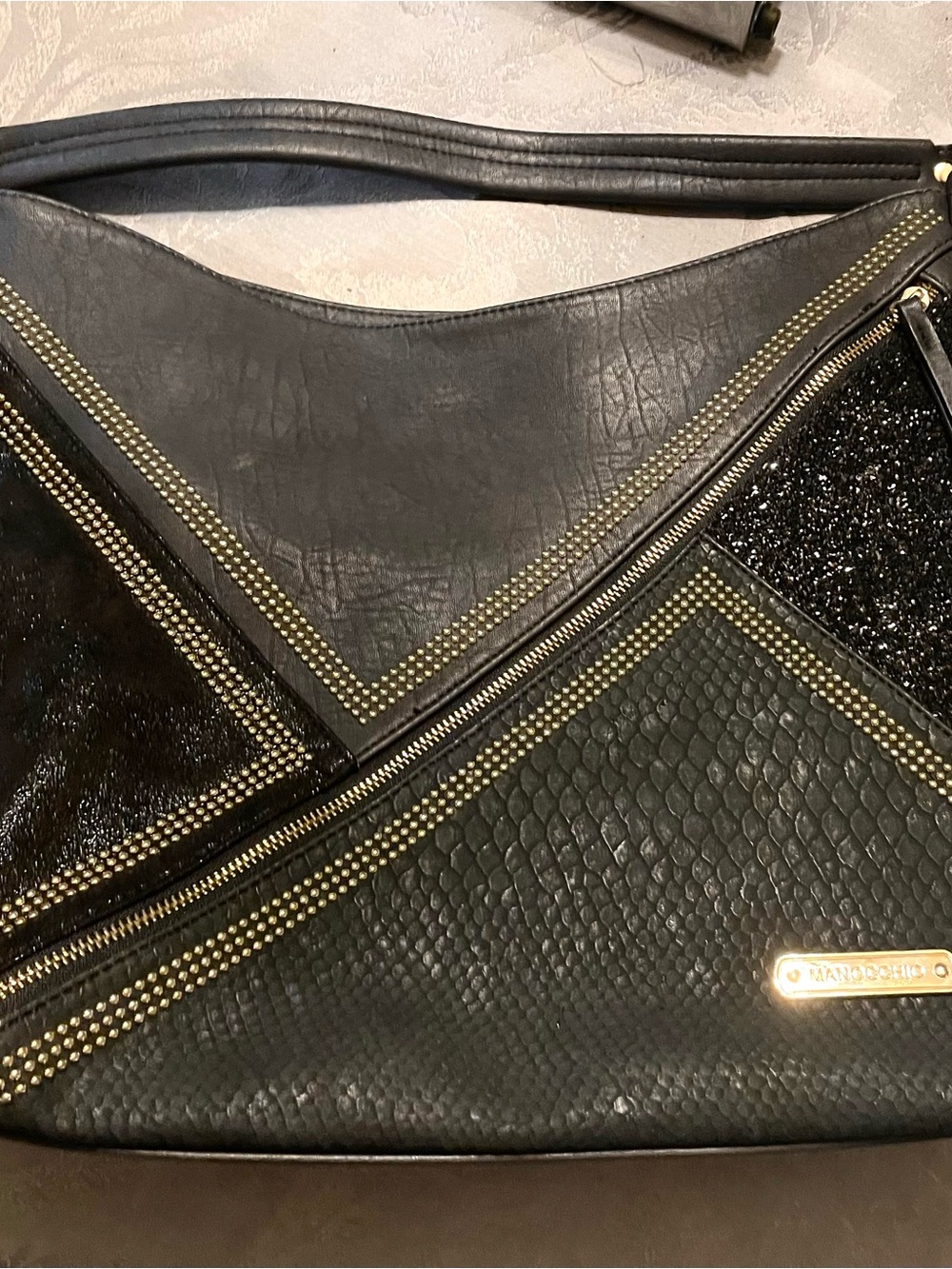 Manocchio black Asymmetric geometric mixed-texture hobo shoulder bag.